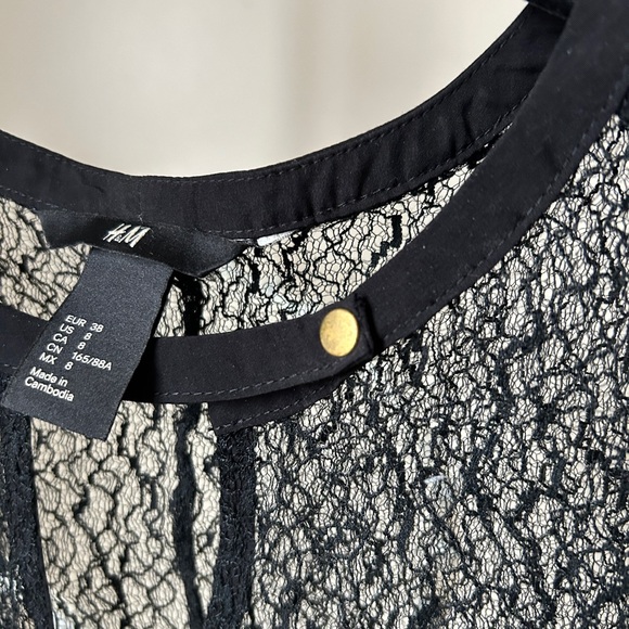 Sheer, textured black top with snap collar - Picture 3 of 5